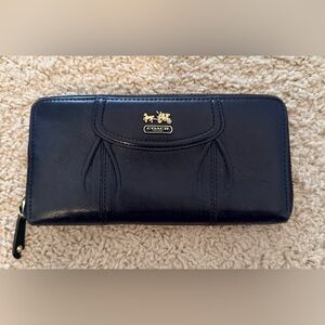 Coach Madison Accordion Zip Around Wallet in black leather.